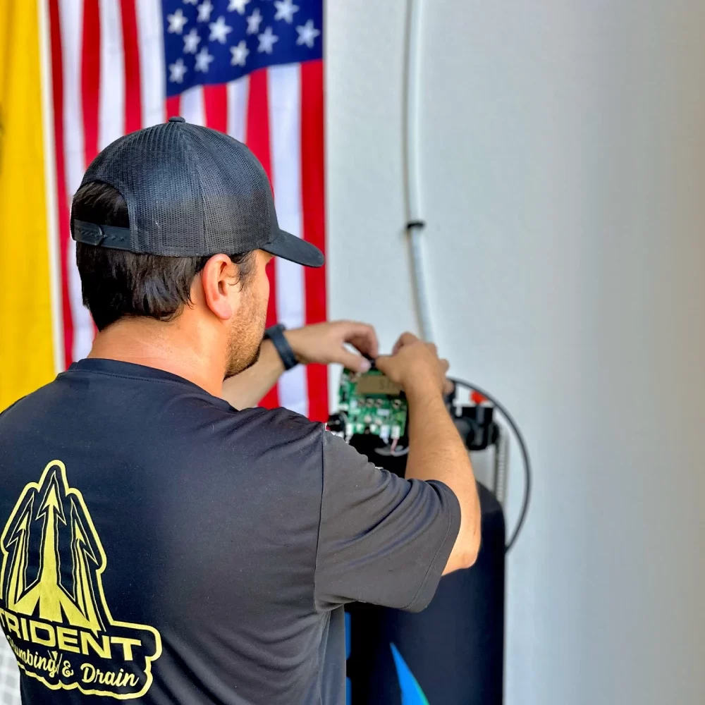 plumber installing water filtration