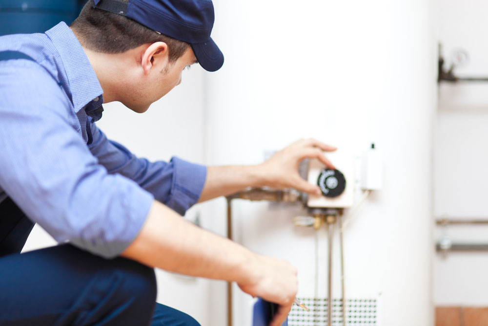 Trident technician servicing a water heating system