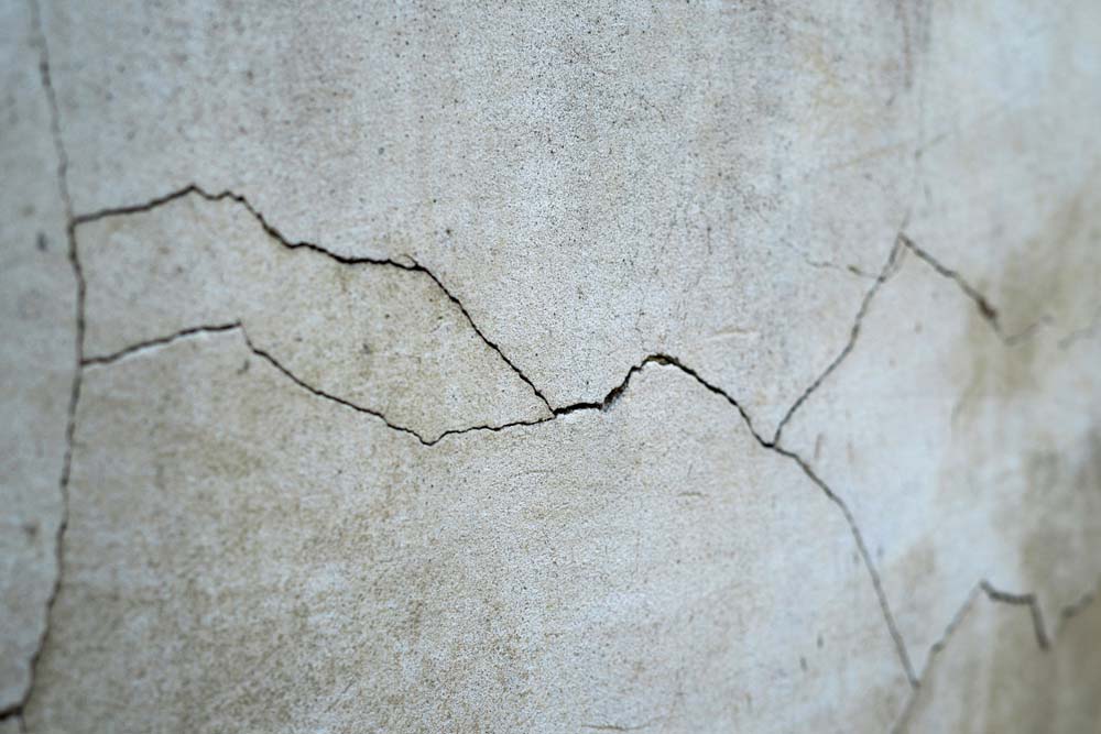 cracks in a property foundation due to a slab leak