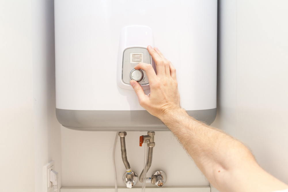 vacation mode setting on a water heating system