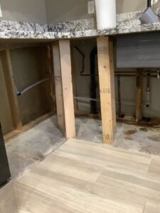 copper plumbing line reroute through wall studs to bypass slab leak